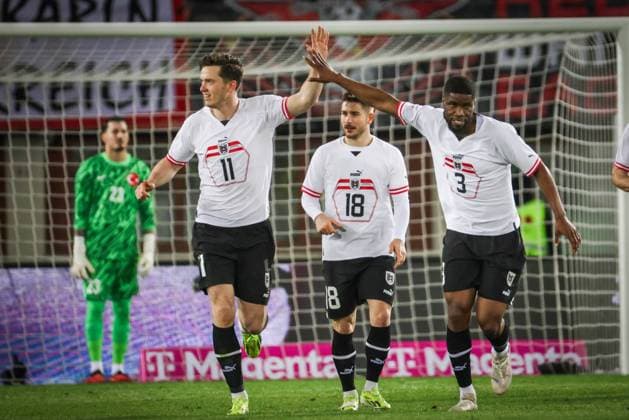 SOCCER - AUT vs TUR, test match VIENNA,AUSTRIA,26.MAR.24 - SOCCER - OEFB International Friendly, Länderspiel, Nationalmannschaft match, Austria vs Turkey. Image shows the rejoicing of Michael Gregoritsch, Kevin Danso and Romano Schmid (AUT).  GEPAxpictures xDavidxBitzan