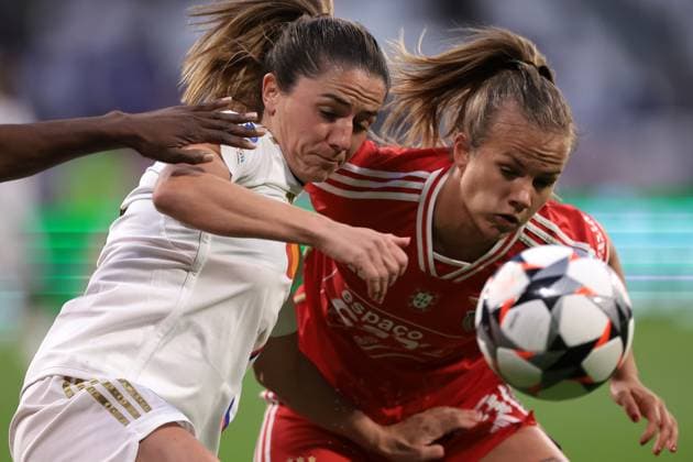 Lyon, France, 27th March 2024. Danielle Van De Donk of Lyon tussles with Anna Gasper of SL Benfica during the UEFA Womens Champions League match at OL Stadium, Lyon. Picture credit should read: Jonathan Moscrop Sportimage EDITORIAL USE ONLY. No use with unauthorised audio, video, data, fixture lists, club league logos or live services. Online in-match use limited to 120 images, no video emulation. No use in betting, games or single club league player publications. SPI-3032-0001