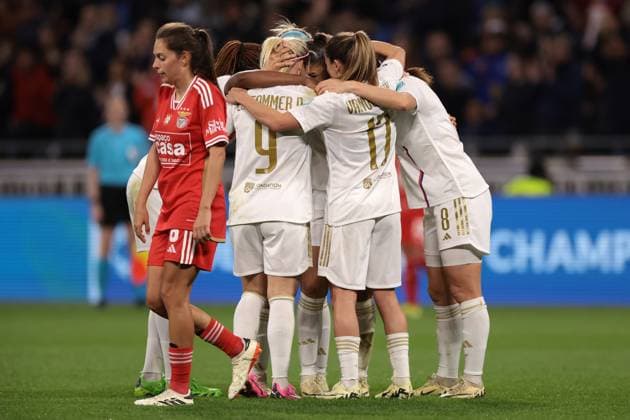 Lyon, France, 27th March 2024. Andreia Faria of SL Benfica reacts as Delphine Cascarino of Lyon celebrates with team mates after scoring to give the side a 1-0 lead during the UEFA Womens Champions League match at OL Stadium, Lyon. Picture credit should read: Jonathan Moscrop Sportimage EDITORIAL USE ONLY. No use with unauthorised audio, video, data, fixture lists, club league logos or live services. Online in-match use limited to 120 images, no video emulation. No use in betting, games or single club league player publications. SPI-3032-0011