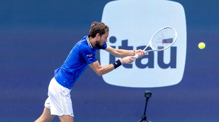 Daniil Medvedev hits a backhand shot to Jannik Sinner from Italy during the Miami Open men s semifinals at the Hard Rock Stadium in Miami Gardens, Florida on Friday, March 29, 2024. Sinner defeated Medvedev 6-1,6-2 to advance to the men s finial. Photos By Gary I Rothstein UPI  MIA20240329113 GaryxIxRothstein