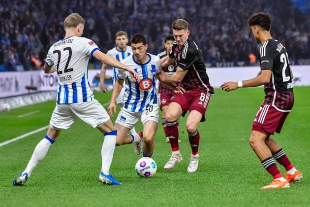 30 03 2024, xlakx, Soccer 2 Bundesliga, Hertha BSC 1 FC Nuernberg emspor, v l Marten Winkler Hertha BSC 22 ,Ibrahim Maza Hertha BSC 30 ,Florian Flick 1 FC Nuenberg 6 ,Zweikampf, Duell, Kampf, tackle DFL DFB REGULATIONS PROHIBIT ANY USE OF PHOTOGRAPHS as IMAGE SEQUENCES and or QUASI VIDEO Berlin