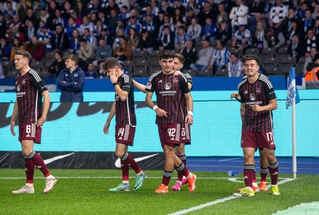 Soccer, Men, Season 2023 2024, 2 Bundesliga 27 Matchday , Hertha BSC 1 FC Nürnberg, f l Benjamin Goller 1 FC Nürnberg , Can Uzun 1 FC Nürnberg , Jens Castrop 1 FC Nürnberg , Celebration after goal to 0 1, 30 03 2024, Copyright: xSebastianxRäppold MatthiasxKochx