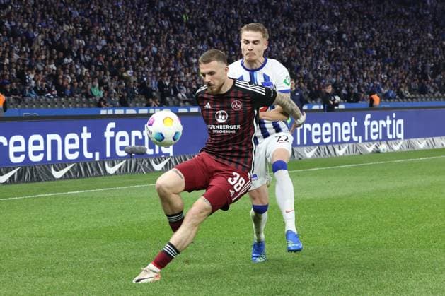 DEU, DFL, 2 FBL, Hertha BSC vs 1 FC Nuernberg, 30 03 2024, Berliner Olympiastadion, Berlin, DEU, DFL, 2 FBL, Hertha BSC vs 1 FC Nuernberg, im Bild Marten Winkler Hertha BSC Berlin 22 , Jannes Horn 1 FC Nuernberg 38 DFL regulations prohibit any use of Photographs as image sequences and or quasi video Foto Juergen Engler nordphoto GmbH nordphotoxGmbHx xEngler nph00076