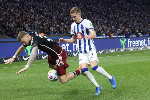 DEU, DFL, 2 FBL, Hertha BSC vs 1 FC Nuernberg, 30 03 2024, Berliner Olympiastadion, Berlin, DEU, DFL, 2 FBL, Hertha BSC vs 1 FC Nuernberg, im Bild Marten Winkler Hertha BSC Berlin 22 , Jannes Horn 1 FC Nuernberg 38 DFL regulations prohibit any use of Photographs as image sequences and or quasi video Foto Juergen Engler nordphoto GmbH nordphotoxGmbHx xEngler nph00076