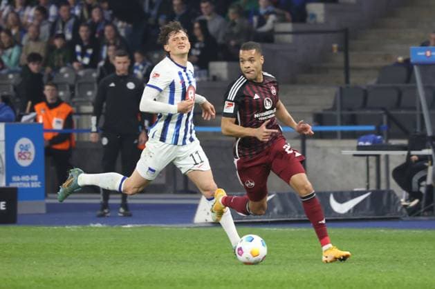 DEU, DFL, 2 FBL, Hertha BSC vs 1 FC Nuernberg, 30 03 2024, Berliner Olympiastadion, Berlin, DEU, DFL, 2 FBL, Hertha BSC vs 1 FC Nuernberg, im Bild Fabian Reese Hertha BSC Berlin 11 , Jan Gyamerah 1 FC Nuernberg 28 DFL regulations prohibit any use of Photographs as image sequences and or quasi video Foto Juergen Engler nordphoto GmbH nordphotoxGmbHx xEngler nph00076