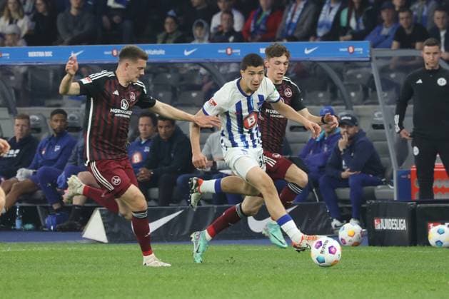 DEU, DFL, 2 FBL, Hertha BSC vs 1 FC Nuernberg, 30 03 2024, Berliner Olympiastadion, Berlin, DEU, DFL, 2 FBL, Hertha BSC vs 1 FC Nuernberg, im Bild Ibrahim Maza Hertha BSC Berlin 30 , Finn Jeltsch 1 FC Nuernberg 44 , Tom Krauss 1 FC Nuernberg 14 DFL regulations prohibit any use of Photographs as image sequences and or quasi video Foto Juergen Engler nordphoto GmbH nordphotoxGmbHx xEngler nph00076