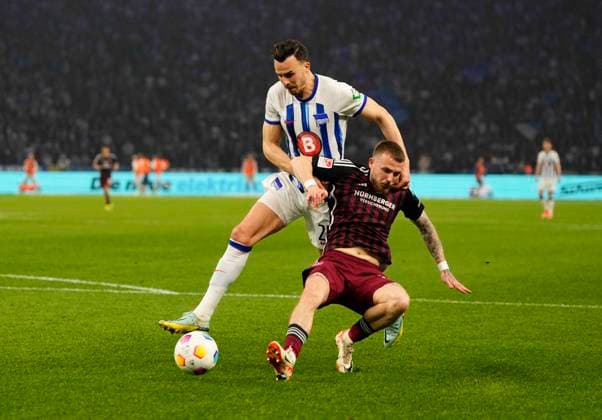 Germany, Berlin, 30 03 2024, Olympic Stadium, Hertha BSC vs 1 FC Nürnberg 2 Bundesliga, Haris Tabakovic Hertha Berlin and Jannes Horn 1 FC Nürnberg battle for the ball Berlin Olympic Stadium Berlin Germany eu-images-659