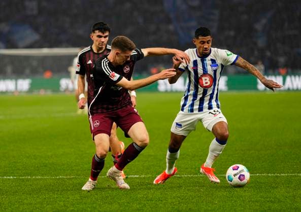Germany, Berlin, 30 03 2024, Olympic Stadium, Hertha BSC vs 1 FC Nürnberg 2 Bundesliga, Jeremy Dudziak Hertha Berlin and Finn Jeltsch 1 FC Nürnberg battle for the ball Berlin Olympic Stadium Berlin Germany eu-images-659