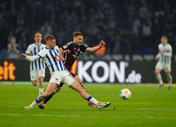 Germany, Berlin, 30 03 2024, Olympic Stadium, Hertha BSC vs 1 FC Nürnberg 2 Bundesliga, Marton Dardai Hertha Berlin and Lukas Schleimer 1 FC Nürnberg battle for the ball Berlin Olympic Stadium Berlin Germany eu-images-659