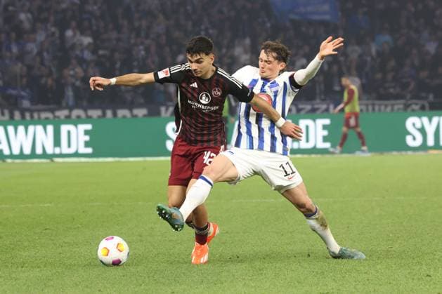 DEU, DFL, 2 FBL, Hertha BSC vs 1 FC Nuernberg, 30 03 2024, Berliner Olympiastadion, Berlin, DEU, DFL, 2 FBL, Hertha BSC vs 1 FC Nuernberg, im Bild Fabian Reese Hertha BSC Berlin 11 , Can Yilmaz Uzun 1 FC Nuernberg 42 DFL regulations prohibit any use of Photographs as image sequences and or quasi video Foto Juergen Engler nordphoto GmbH nordphotoxGmbHx xEngler nph00076