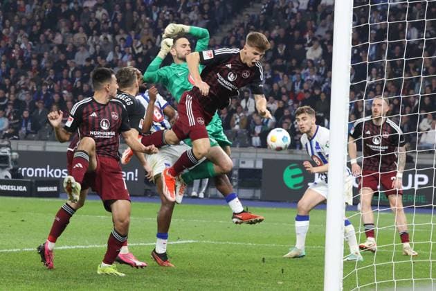 DEU, DFL, 2 FBL, Hertha BSC vs 1 FC Nuernberg, 30 03 2024, Berliner Olympiastadion, Berlin, DEU, DFL, 2 FBL, Hertha BSC vs 1 FC Nuernberg, im Bild Marius Gersbeck Hertha BSC Berlin 35 , Finn Jeltsch 1 FC Nuernberg 44 DFL regulations prohibit any use of Photographs as image sequences and or quasi video Foto Juergen Engler nordphoto GmbH nordphotoxGmbHx xEngler nph00076