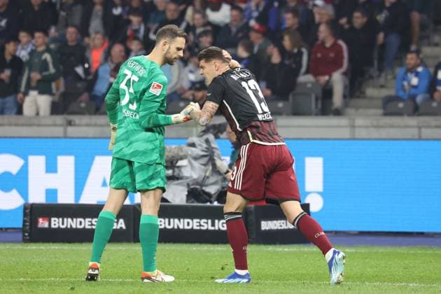 DEU, DFL, 2 FBL, Hertha BSC vs 1 FC Nuernberg, 30 03 2024, Berliner Olympiastadion, Berlin, DEU, DFL, 2 FBL, Hertha BSC vs 1 FC Nuernberg, im Bild Marius Gersbeck Hertha BSC Berlin 35 , Erik Wekesser 1 FC Nuernberg 13 DFL regulations prohibit any use of Photographs as image sequences and or quasi video Foto Juergen Engler nordphoto GmbH nordphotoxGmbHx xEngler nph00076