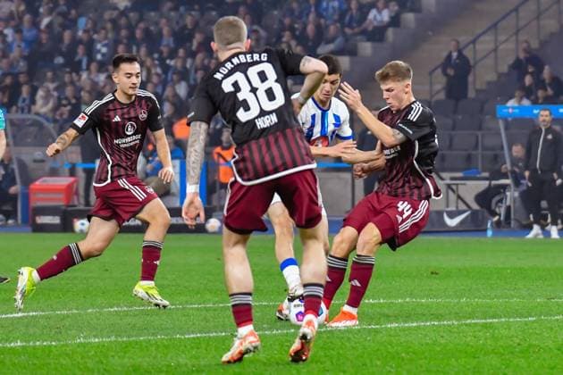 30 03 2024, xlakx, Soccer 2 Bundesliga, Hertha BSC 1 FC Nuernberg emspor, v l Jannes Horn 1 FC Nuenberg 38 ,Ibrahim Maza Hertha BSC 30 ,Finn Jeltsch 1 FC Nuenberg 44 ,Zweikampf, Duell, Kampf, tackle DFL DFB REGULATIONS PROHIBIT ANY USE OF PHOTOGRAPHS as IMAGE SEQUENCES and or QUASI VIDEO Berlin