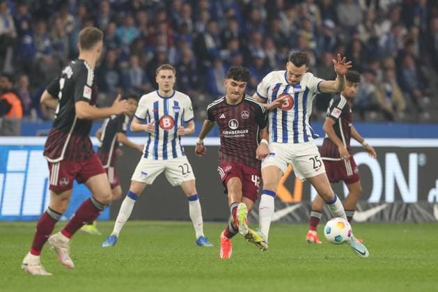 30 03 2024, xtgx, Football 2 Bundesliga, Hertha BSC Berlin 1 FC Nuernberg emspor, v l Can Yilmaz Uzun Nuernberg, 42 , Haris Tabakovic Hertha, 25 duel, duel, fight, tackle DFL DFB REGULATIONS PROHIBIT ANY USE OF PHOTOGRAPHS as IMAGE SEQUENCES and or QUASI VIDEO Berlin