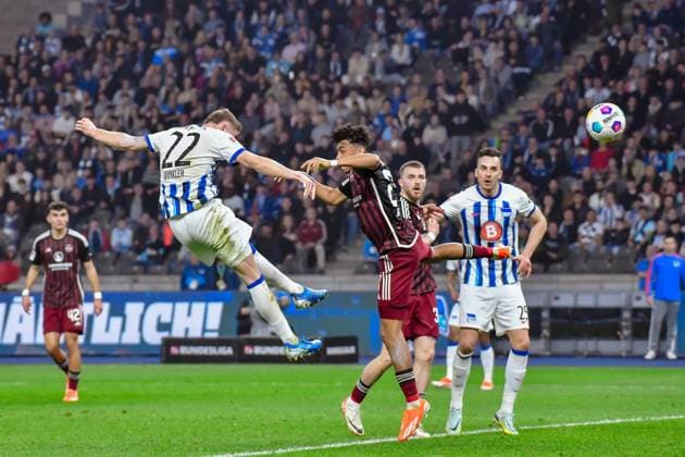 30 03 2024, xlakx, Fußball 2 Bundesliga, Hertha BSC 1 FC Nuernberg emspor, v l the header by Marten Winkler Hertha BSC 22 jubilation after the 1 2,Nathaniel Brown 1 FC Nuenberg 27 DFL DFB REGULATIONS PROHIBIT ANY USE OF PHOTOGRAPHS as IMAGE SEQUENCES and or QUASI VIDEO Berlin