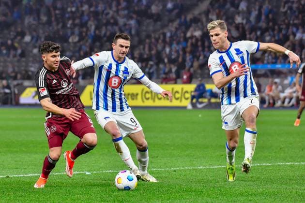30 03 2024, xlakx, Fußball 2 Bundesliga, Hertha BSC 1 FC Nuernberg emspor, v l Taylan Duman 1 FC Nuenberg 8 ,Smail Prevljak Hertha BSC 9 ,Florian Niederlechner Hertha BSC 7 ,Zweikampf, Duell, Kampf, tackle DFL DFB REGULATIONS PROHIBIT ANY USE OF PHOTOGRAPHS as IMAGE SEQUENCES and or QUASI VIDEO Berlin