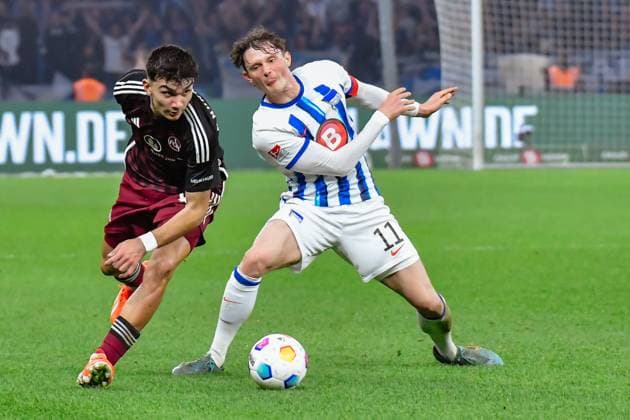 30 03 2024, xlakx, Fußball 2 Bundesliga, Hertha BSC 1 FC Nuernberg emspor, v l Can Yilmaz Uzun 1 FC Nuenberg 42 ,Fabian Reese Hertha BSC 11 ,Zweikampf, Duell, Kampf, tackle DFL DFB REGULATIONS PROHIBIT ANY USE OF PHOTOGRAPHS as IMAGE SEQUENCES and or QUASI VIDEO Berlin