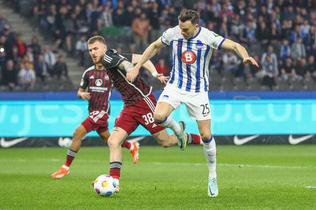 30 03 2024, xtgx, Football 2 Bundesliga, Hertha BSC Berlin 1 FC Nuernberg emspor, v l Jannes Horn Nuernberg, 38 , Haris Tabakovic Hertha, 25 duel, duel, fight, tackle DFL DFB REGULATIONS PROHIBIT ANY USE OF PHOTOGRAPHS as IMAGE SEQUENCES and or QUASI VIDEO Berlin