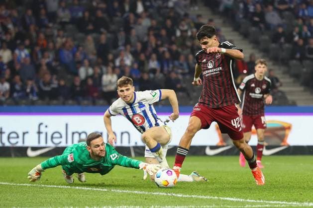 30 03 2024, xtgx, Soccer 2 Bundesliga, Hertha BSC Berlin 1 FC Nuernberg emspor, v l Can Yilmaz Uzun Nuernberg, 42 shot on goal, shoots the ball on goal, shot DFL DFB REGULATIONS PROHIBIT ANY USE OF PHOTOGRAPHS as IMAGE SEQUENCES and or QUASI VIDEO Berlin