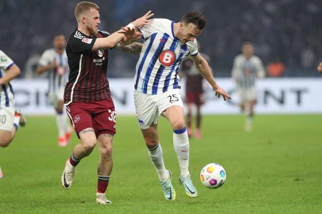 30 03 2024, xtgx, Football 2 Bundesliga, Hertha BSC Berlin 1 FC Nuernberg emspor, v l Jannes Horn Nuernberg, 38 , Haris Tabakovic Hertha, 25 duel, duel, fight, tackle DFL DFB REGULATIONS PROHIBIT ANY USE OF PHOTOGRAPHS as IMAGE SEQUENCES and or QUASI VIDEO Berlin