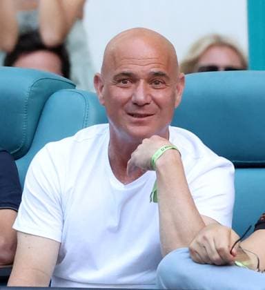 March 30, 2024, Miami Gardens, Florida, United States Of America: MIAMI GARDENS, FLORIDA - MARCH 30: Danielle Collins of the United States defeats Elena Rybakina of Kazakhstan at the womens singles finals on Day 15 of the Miami Open Presented by Itau at Hard Rock Stadium on March 30, 2024 in Miami Gardens, Florida...People: Andre Agassi 2024 Miami Open - Women s finals  - ZUMAs214 20240330_ada_s214_055 Copyright: xSMGx