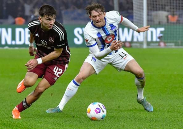 Soccer 2 Bundesliga, Hertha BSC 1 FC Nuernberg 30 03 2024, xdanx, Soccer 2 Bundesliga, Hertha BSC 1 FC Nuernberg, v l Can Yilmaz Uzun 1 FC Nuenberg 42 ,Fabian Reese Hertha BSC 11 ,Zweikampf, duel, fight, tackle DFL DFB REGULATIONS PROHIBIT ANY USE OF PHOTOGRAPHS as IMAGE SEQUENCES and or QUASI VIDEO Photo Daniel Lakomski Mix1 Berlin Olympiastadion Berlin Berlin Germany EN Copyright: xDanielxLakomskix