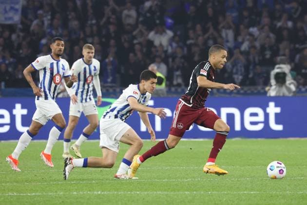 DEU, DFL, 2 FBL, Hertha BSC vs 1 FC Nuernberg, 30 03 2024, Berliner Olympiastadion, Berlin, DEU, DFL, 2 FBL, Hertha BSC vs 1 FC Nuernberg, im Bild Ibrahim Maza Hertha BSC Berlin 30 , Jan Gyamerah 1 FC Nuernberg 28 DFL regulations prohibit any use of Photographs as image sequences and or quasi video Foto Juergen Engler nordphoto GmbH nordphotoxGmbHx xEngler nph00076