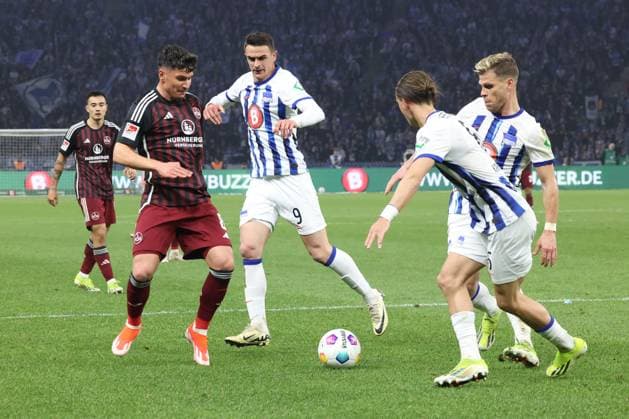 DEU, DFL, 2 FBL, Hertha BSC vs 1 FC Nuernberg, 30 03 2024, Berliner Olympiastadion, Berlin, DEU, DFL, 2 FBL, Hertha BSC vs 1 FC Nuernberg, pictured Smail Prevljak Hertha BSC Berlin 9 , Michal Karbownik Hertha BSC Berlin 6 , Florian Niederlechner Hertha BSC Berlin 7 , Taylan Duman 1 FC Nuernberg 8 DFL regulations prohibit any use of Photographs as image sequences and or quasi video Foto Juergen Engler nordphoto GmbH nordphotoxGmbHx xEngler nph00076