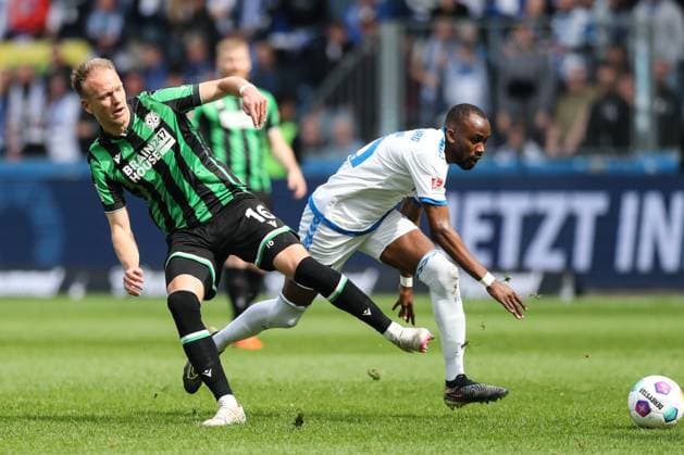 Havard Nielsen Hannover 96,16 vs Silas Gnaka 1 FC Magdeburg,25 2 Soccer Bundesliga Season 2023 2024 1 FC Magdeburg vs Hannover 96 at the MDCC Arena in Magdeburg Action,Soccer,Man,Men,Germany,31 03 2024