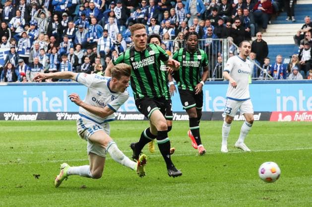 Goalscorer Luca Schuler 1 FC Magdeburg,26 scores to 1 1 against Nicolo Tresoldi Hannover 96,23 , the goal does not count 2 Soccer Bundesliga Season 2023 2024 1 FC Magdeburg vs Hannover 96 at the MDCC Arena in Magdeburg Action,Soccer,Man,Men,Germany,31 03 2024