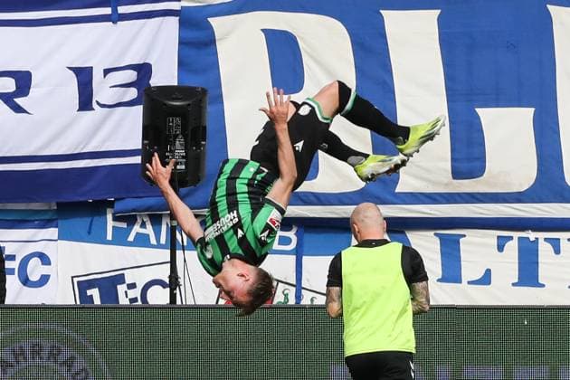Goal celebration goal scorer Jannik Dehm Hannover 96,20 scores to 0 1 2 Soccer Bundesliga season 2023 2024 1 FC Magdeburg vs Hannover 96 at the MDCC Arena in Magdeburg action,soccer,man,men,Germany,31 03 2024