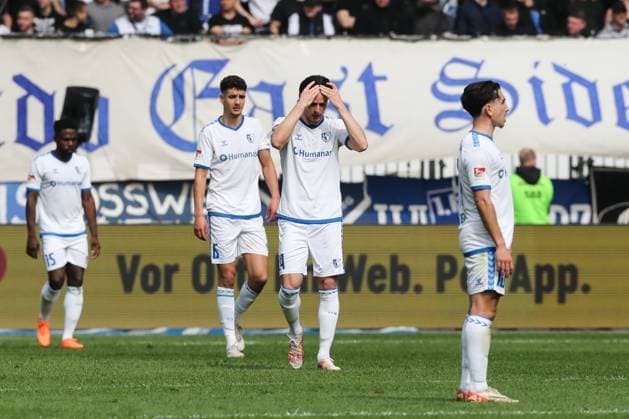 Jean Hugonet 1 FC Magdeburg,24 with Daniel Elfadli 1 FC Magdeburg,6 and Jason Ceka 1 FC Magdeburg,10 after the goal by scorer Jannik Dehm Hannover 96,20 who scores to 0 1 2 Soccer Bundesliga season 2023 2024 1 FC Magdeburg vs Hannover 96 at the MDCC Arena in Magdeburg Action,Soccer,Man,Men,Germany,31 03 2024