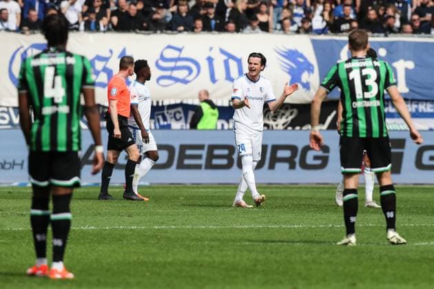 Jean Hugonet 1 FC Magdeburg,24 after the goal of scorer Jannik Dehm Hannover 96,20 who scores to 0 1 2 Soccer Bundesliga Season 2023 2024 1 FC Magdeburg vs Hannover 96 at the MDCC Arena in Magdeburg Action,Soccer,Man,Men,Germany,31 03 2024