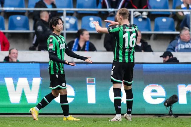 Goal celebration Goalscorer Sei Muroya Hannover 96,21 scores to 0 2 with Havard Nielsen Hannover 96,16 2 Soccer Bundesliga Season 2023 2024 1 FC Magdeburg vs Hannover 96 at the MDCC Arena in Magdeburg Action,Soccer,Man,Men,Germany,31 03 2024