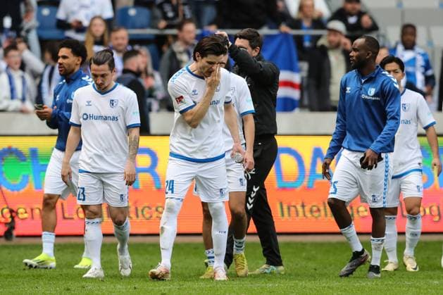 f l Baris Atik 1 FC Magdeburg,23 , Jean Hugonet 1 FC Magdeburg,24 , Silas Gnaka 1 FC Magdeburg,25 disappointed after the match 2 Soccer Bundesliga Season 2023 2024 1 FC Magdeburg vs Hannover 96 at the MDCC Arena in Magdeburg Action,Soccer,Man,Men,Germany,31 03 2024