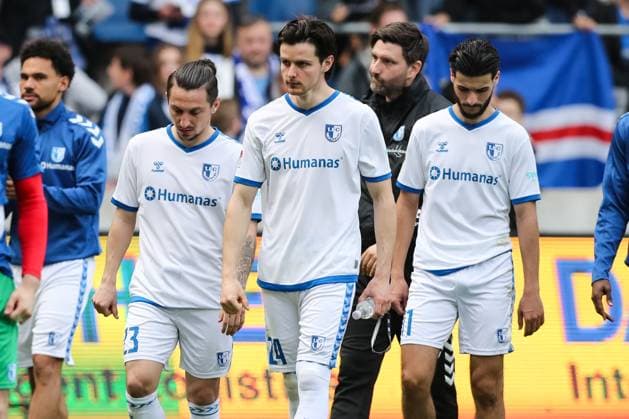 v l Baris Atik 1 FC Magdeburg,23 , Jean Hugonet 1 FC Magdeburg,24 , Mohammed El Hankouri 1 FC Magdeburg,11 disappointed after the match 2 Football Bundesliga Season 2023 2024 1 FC Magdeburg vs Hannover 96 at the MDCC Arena in Magdeburg Action,Football,Man,Men,Germany,31 03 2024