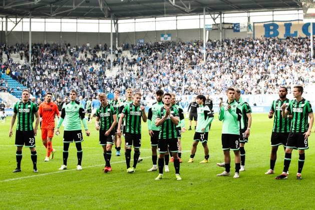 The Hannover 96 team celebrates after the match in front of the fan block 2 Soccer Bundesliga season 2023 2024 1 FC Magdeburg vs Hannover 96 at the MDCC Arena in Magdeburg Action,Soccer,Man,Men,Germany,31 03 2024