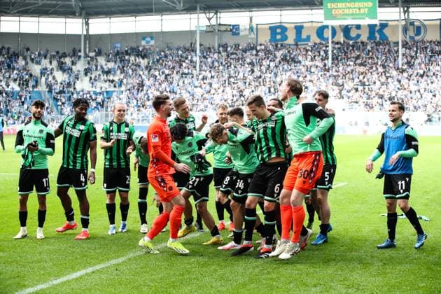 Goalkeeper Ron Robert Zieler Hannover 96,1 celebrates with the team of Hannover 96 after the match in front of the fan block 2 Soccer Bundesliga season 2023 2024 1 FC Magdeburg vs Hannover 96 at the MDCC Arena in Magdeburg action,soccer,man,men,Germany,31 03 2024
