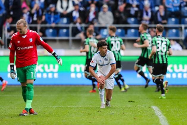 Daniel Elfadli 1 FC Magdeburg,6 and goalkeeper Dominik Reimann 1 FC Magdeburg,1 after the goal to 0 2 by Sei Muroya Hannover 96,21 2 Soccer Bundesliga Season 2023 2024 1 FC Magdeburg vs Hannover 96 at the MDCC Arena in Magdeburg Action,Soccer,Man,Men,Germany,31 03 2024