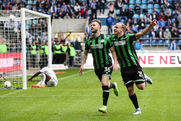 Goalscorer Cedric Teuchert Hannover 96,36 scores to 0 3 with Lars Timo Gindorf Hannover 96,25 2 Soccer Bundesliga Season 2023 2024 1 FC Magdeburg vs Hannover 96 at the MDCC Arena in Magdeburg Action,Soccer,Man,Men,Germany,31 03 2024