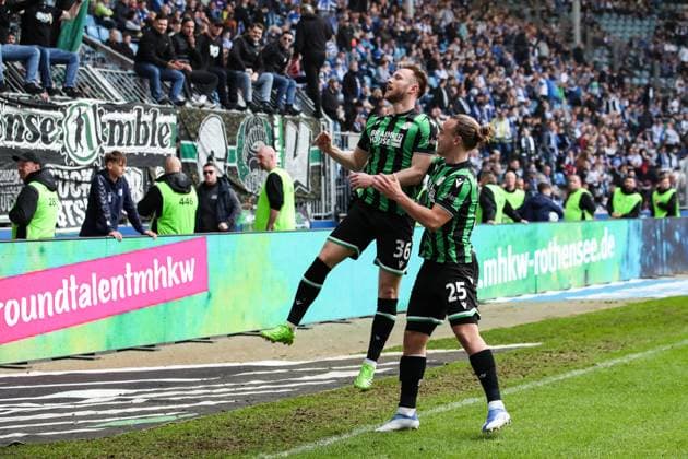Goalscorer Cedric Teuchert Hannover 96,36 scores to 0 3 with Lars Timo Gindorf Hannover 96,25 2 Soccer Bundesliga Season 2023 2024 1 FC Magdeburg vs Hannover 96 at the MDCC Arena in Magdeburg Action,Soccer,Man,Men,Germany,31 03 2024