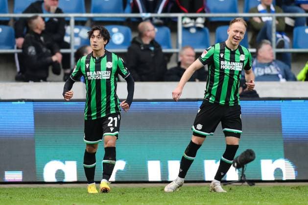 Goal celebration Goalscorer Sei Muroya Hannover 96,21 scores to 0 2 with Havard Nielsen Hannover 96,16 2 Soccer Bundesliga Season 2023 2024 1 FC Magdeburg vs Hannover 96 at the MDCC Arena in Magdeburg Action,Soccer,Man,Men,Germany,31 03 2024