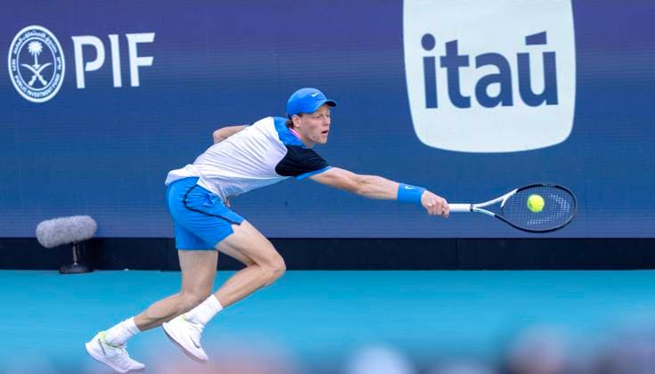 Jinnik Sinner from Italy hits a backhand shot to Grigor Dimitrov from Bulgaria in the Miami Open man s finals at the Hard Rock Stadium in Miami Gardens, Florida on Sunday, March 31, 2024. Photos By Gary I Rothstein UPI  MIA20240331118 GaryxIxRothstein