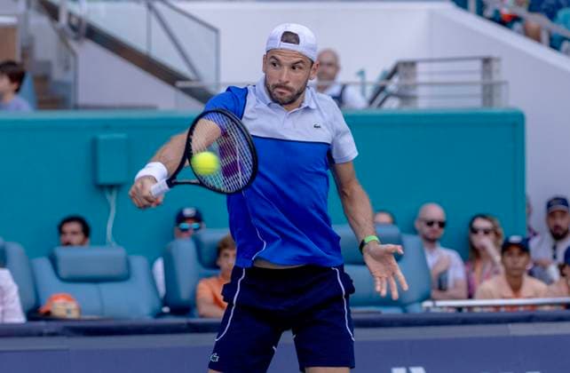 Grigor Dimitrov from Bulgaria hits a backhand to Jinnik Sinner from Italy in the Miami Open man s finals at the Hard Rock Stadium in Miami Gardens, Florida on Sunday, March 31, 2024. Sinner defeated Dimitrov 6-3, 6-1.Photos By Gary I Rothstein UPI  MIA20240331111 GaryxIxRothstein