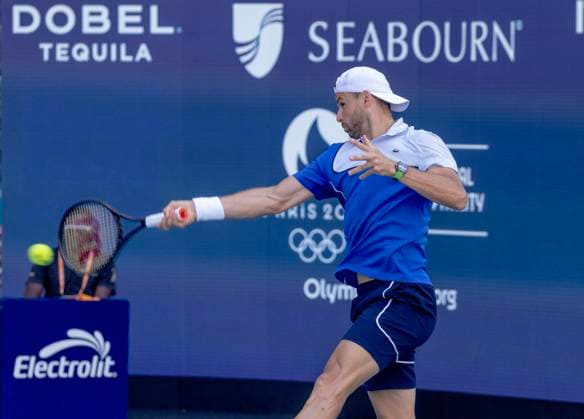 Grigor Dimitrov from Bulgaria hits a forehand to Jinnik Sinner from Italy in the Miami Open man s finals at the Hard Rock Stadium in Miami Gardens, Florida on Sunday, March 31, 2024. Sinner defeated Dimitrov 6-3, 6-1.Photos By Gary I Rothstein UPI  MIA20240331112 GaryxIxRothstein