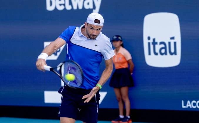 Grigor Dimitrov from Bulgaria hits a backhand to Jinnik Sinner from Italy in the Miami Open man s finals at the Hard Rock Stadium in Miami Gardens, Florida on Sunday, March 31, 2024. Sinner defeated Dimitrov 6-3, 6-1.Photos By Gary I Rothstein UPI  MIA20240331113 GaryxIxRothstein