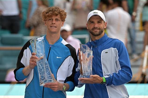 MIAMI GARDENS, FL - MARCH 31: Jannik Sinner (Italy), left, wins the men™s singles finals match against Grigor Dimitrov (Bulgaria), right, at the Miami Open on March 31, 2024, at Hard Rock Stadium in Miami Gardens, FL. (Photo by Michele Eve Sandberg Icon Sportswire) TENNIS: MAR 31 Miami Open EDITORIAL USE ONLY Icon2403310990