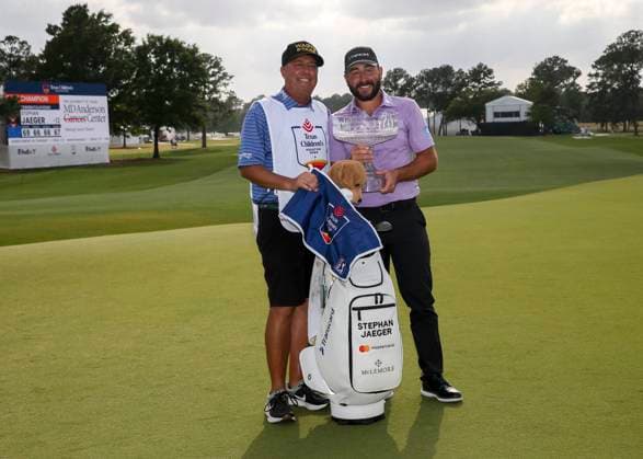 HOUSTON, TX - MARCH 31: (left to right) Caddie Henry Diana and Stephan Jaeger (GER) pose with trophy during the final round of the PGA, Golf Herren Texas Children™s Houston Open at Memorial Park Golf Course on March 31, 2024 in Houston, Texas. (Photo by Leslie Plaza Johnson Icon Sportswire) GOLF: MAR 31 PGA Texas Children s Houston Open EDITORIAL USE ONLY Icon240331142