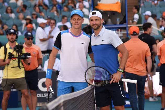 MIAMI GARDENS, FL - MARCH 31: Jannik Sinner (Italy), left, wins the menÕs singles finals against Grigor Dimitrov (Bulgaria) at the Miami Open on March 31, 2024, at Hard Rock Stadium in Miami Gardens, FL. (Photo by Michele Eve Sandberg Icon Sportswire) TENNIS: MAR 31 Miami Open EDITORIAL USE ONLY Icon2403310994