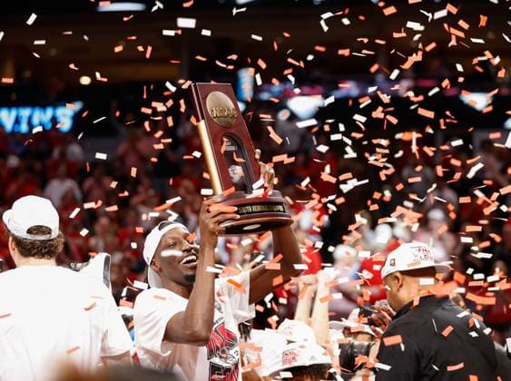 March 31, 2024, Dallas, Texas, USA: NC State forward MOHAMED DIARRA (23) holds up the Regional Final trophy after the NCAA, College League, USA MenÃ¢â‚¬â ¢s Basketball Tournament Regional Final game between Duke and NC State on March 31, 2024. NC State upset Duke, 76-64, to advance to the Final Four. Dallas USA - ZUMAc201 20240331_zap_c201_065 Copyright: xScottxColemanx
